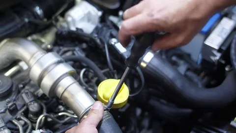 Mechanic working on car engine slow motion 4k Stock Footage 82733276
