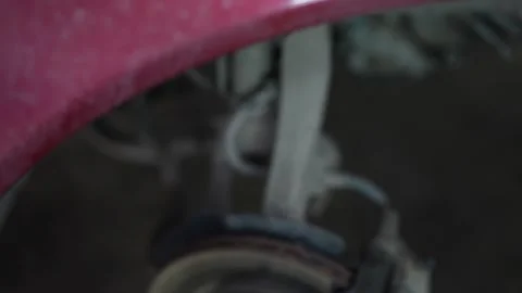 Mechanic Working on Car Wheel Hub Stock Footage 345571203