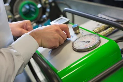 Mechanic working with compressor Stock Photos