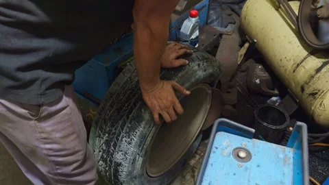 Mechanic Working on Damage Tire in Workshop Stock Footage 311620383