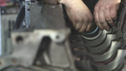 Mechanic working with diesel engine. Engine repair close up. In hands tool Stock Footage 74915826