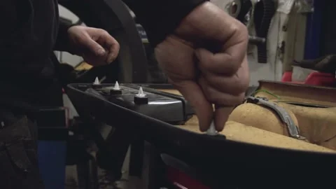 Mechanic working on e36 door card Stock Footage 170697244
