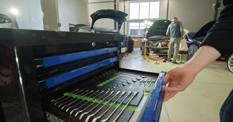 Mechanic Working On Electric Car In Auto Repair Shop Stock Footage 277265926