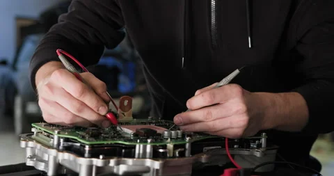 Mechanic Working on Electric Car Engine Maintenance with Tools Video stock 277343917