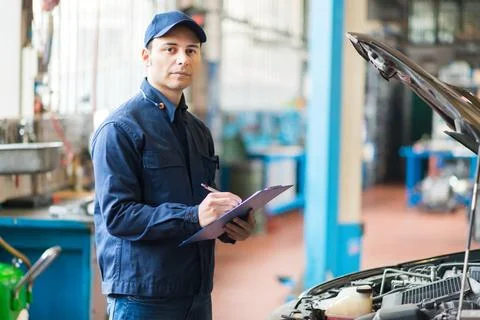 Mechanic working in his workshop 写真素材