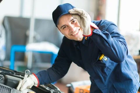 Mechanic working in his workshop Stock Photos