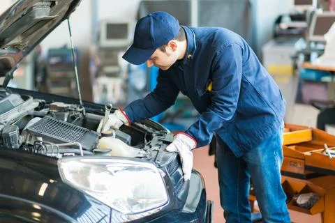 Mechanic working in his workshop Stock Photos