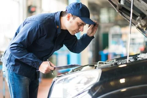 Mechanic working in his workshop 写真素材