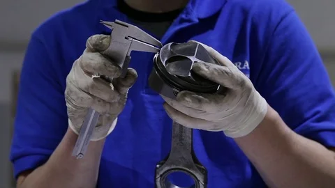 Mechanic working on a motorcycle engine Stock Footage 71074464