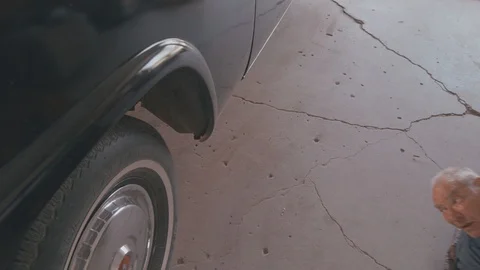 Mechanic working under classic car Stock Footage 105205452