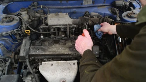 Mechanic working on vehicle engine Stock Footage 127638852