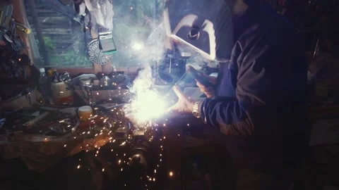 Mechanic working as a welder in a workshop Stock Footage 152586195