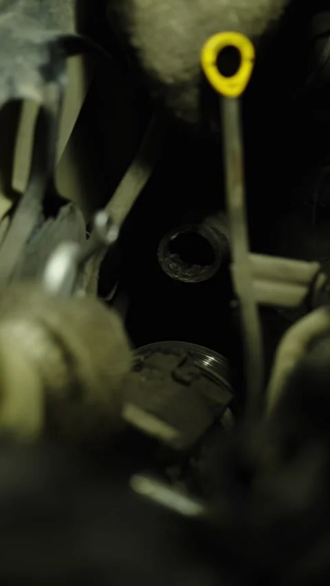A mechanic works on dark car engine bay parts close-up. Stock Footage 338364960