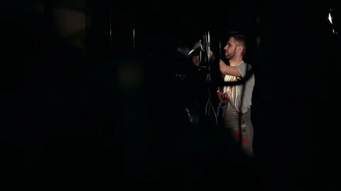 Mechanic works with electrical equipment in dark. Stock Footage 74288255