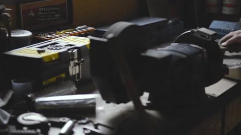 Mechanic in workshop cleans the table Stock Footage 62957359