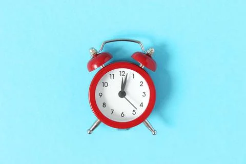 Mechanical alarm clock on a colored background Fotos Stock