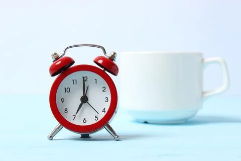 Mechanical alarm clock on a colored background Stock-Fotos