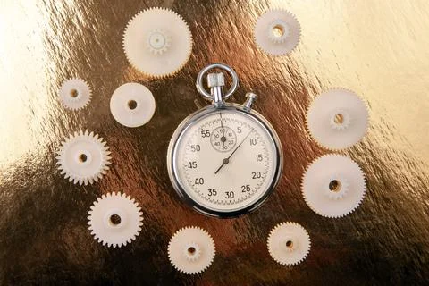 Mechanical analog stopwatch on a colored background. Time part precision. M.. Stock Photos