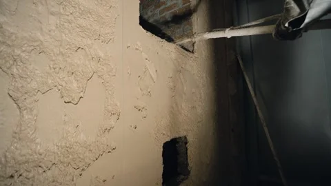 Mechanical application of mortar on the wall Stock Footage 302777763