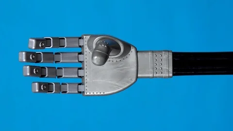 A mechanical arm flexes fingers. Gray cyborg arm came to life and began to move Video stock 126667024