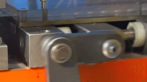 Mechanical Arm Rhythmically Moving Steel Block Inside Industrial Machine Stock Footage 340486469