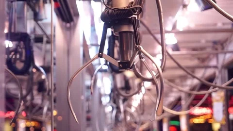 A mechanical arm selecting a random soft toy in a vending machine. Stock Footage 72606463