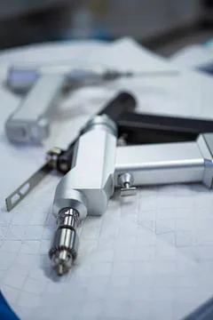 Mechanical caliper tool on paper with technical drawing Stock Photos