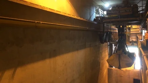 Mechanical Claw picking up dry ash in Industrial Facility Stock Footage 91035756