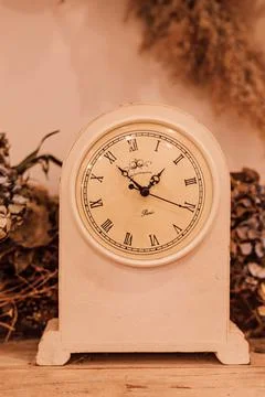 Mechanical clock with an alarm clock on the table in the interior. Loft style Stock Photos