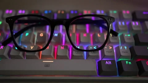 Mechanical computer keyboard eyeglass mouse viewing footage Stock Footage 290950447