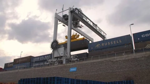  Mechanical Crane lifting up Container outside a Factory / Transportation  Stock Footage 131956748