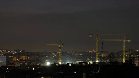 Mechanical cranes working on night skyline in rome italy timelapse Stock Footage 103344823