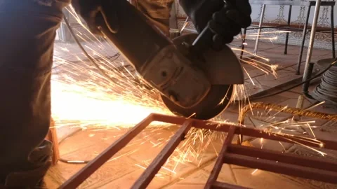 Mechanical cutting of metal with a disk machine with flying sparks Stock Footage 261741486