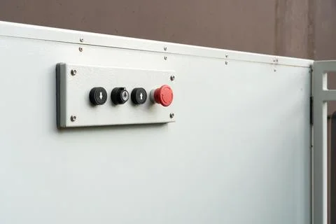 A mechanical device with a remote control and large buttons. Electrical selec Stock Photos