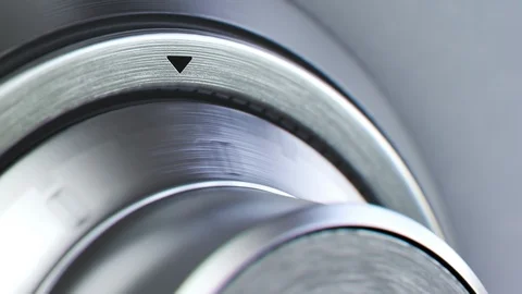 "Mechanical dial combination safe full of gold bars mounted on a white wall." Stock Footage 97463452