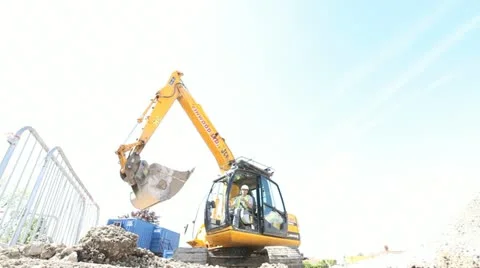 Mechanical Diger and construction worker Stock-Footage 11024330