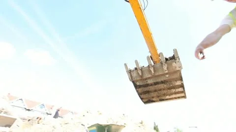 Mechanical Diger and construction worker Video stock 11024348