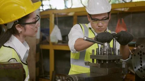 Mechanical engineer and operation team wearing uniform safety working metal l Stock Photos
