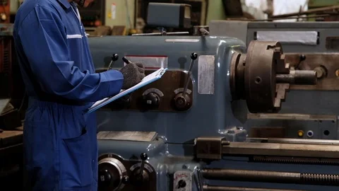 Mechanical engineer are checking machine in the factory for maintenance cycle. Stock Footage 126281176