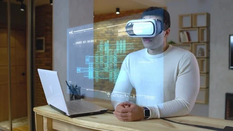 Mechanical engineer checking on a project wearing vr set, futuristic jobs, AR Video stock 125467249