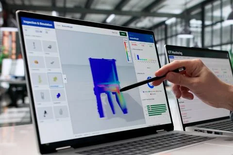 Mechanical Engineer Examines 3D Structural Stress Analysis On Laptop Screen Stock Photos