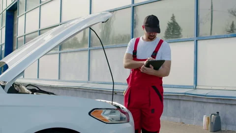 Mechanical engineer performs and meticulously inspects the machine to identify Stock Footage 279807520