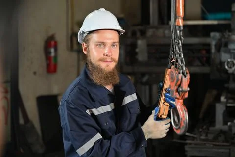 Mechanical engineer repairing engine machine at factory Foto stock