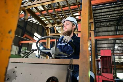 Mechanical engineer repairing engine machine at factory Stock Photos