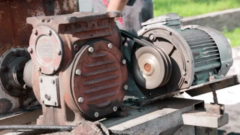 Mechanical engineering industry. The old engine works deftly on site. Rusty case Stock Footage 178492735