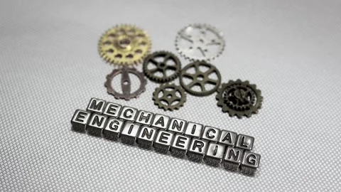 Mechanical engineering text and vintage gears rotating concept on a metal s.. Stock Footage 339264789