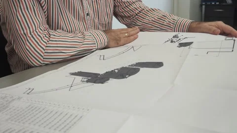 Mechanical engineers, designers discuss problems on blueprints. Slide Stock Footage 151663157