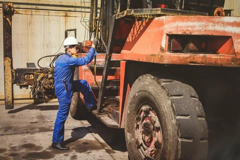 Mechanical engineers prepare to work on safety inspections, lifting cranes. Stock Photos