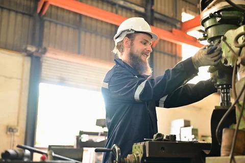 Mechanical engineers repairing engine machine at factory 写真素材