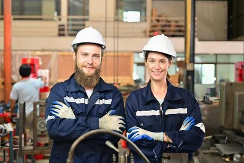 Mechanical engineers repairing engine machine at factory 写真素材
